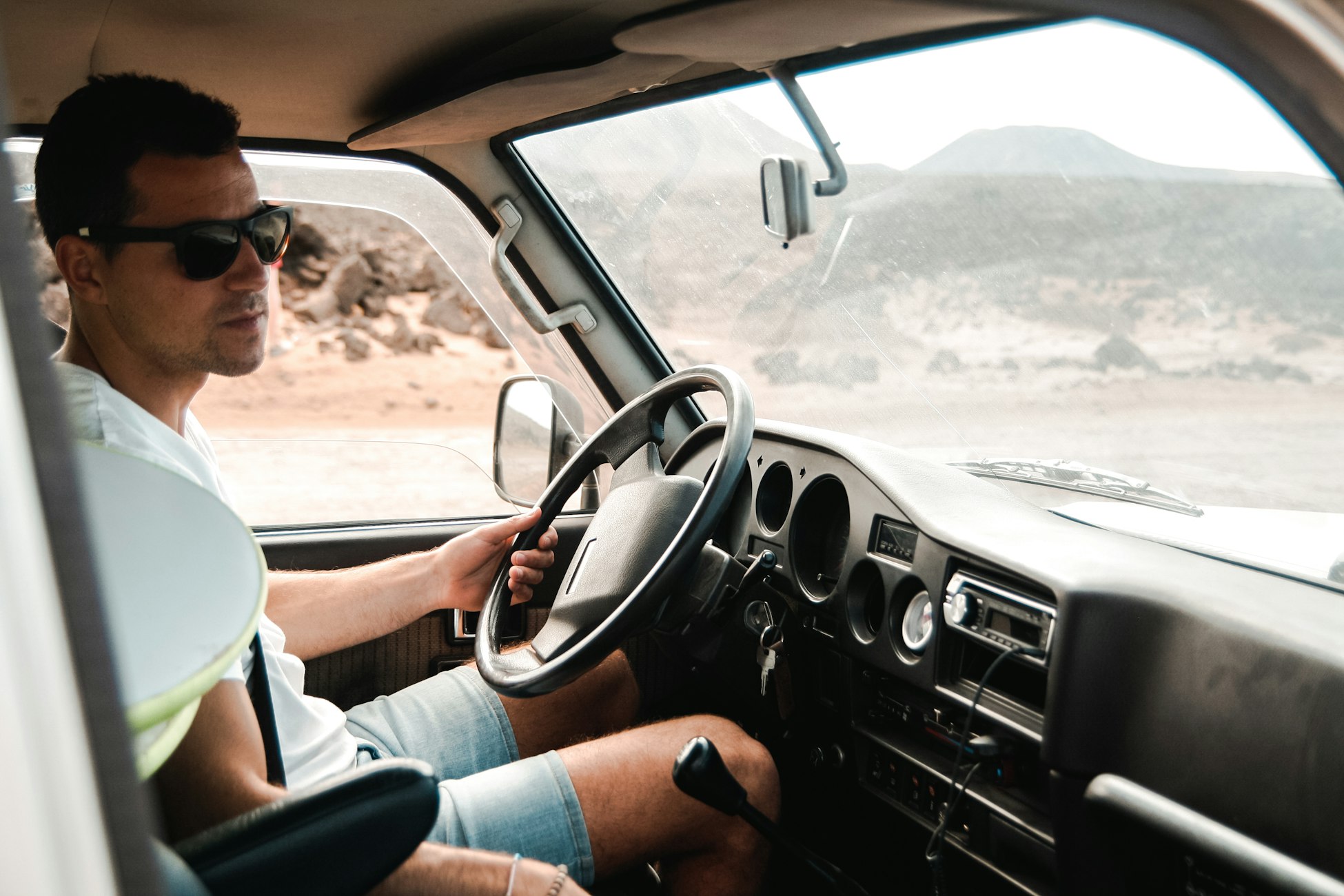 Driver in sunglasses at the wheel